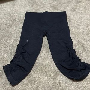 These are lululemon leggings. Size 4 and the color is a darkish purple.